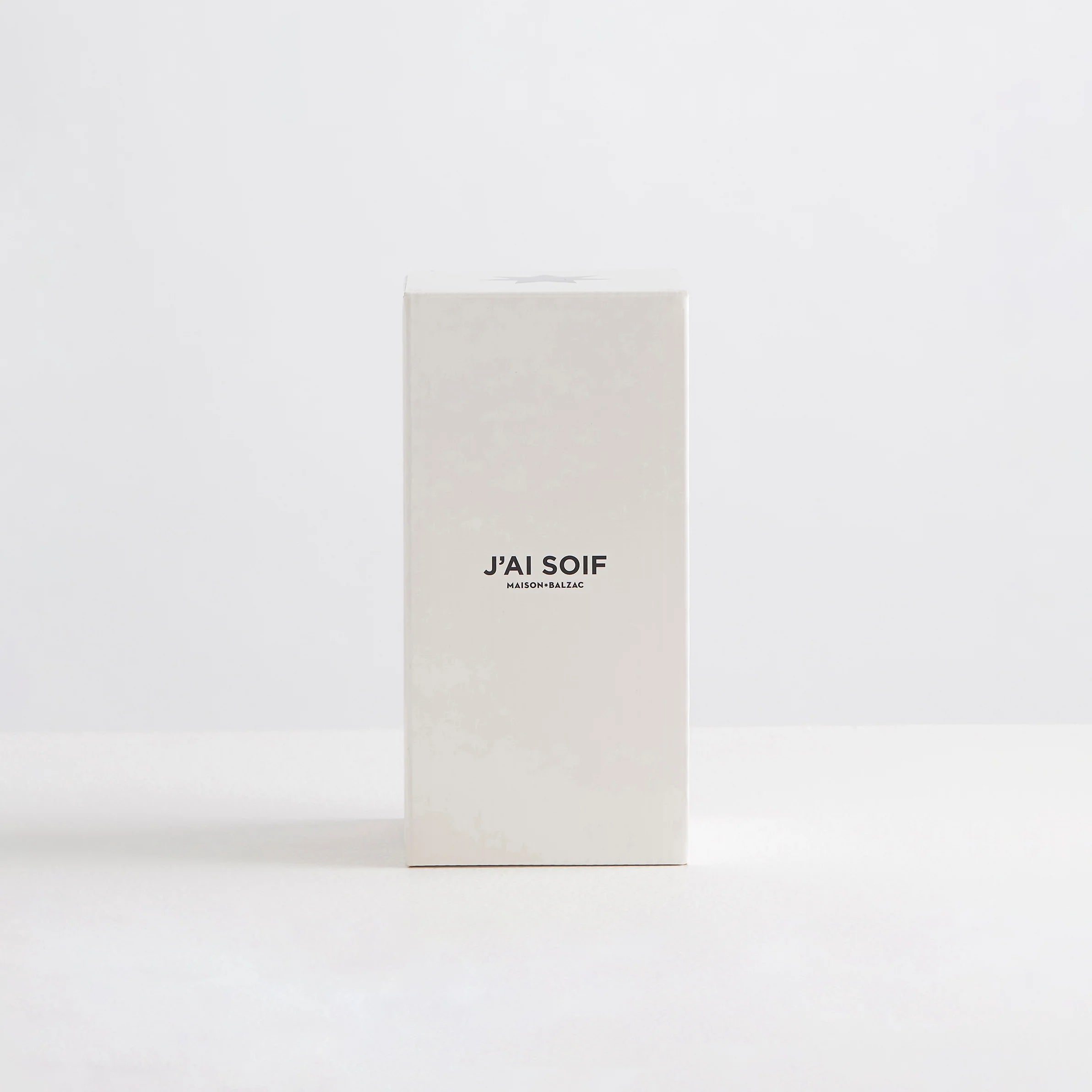 A white box with the words "J'ai Soif" printed along the front. Designed to hold the Maison Balzac carafe