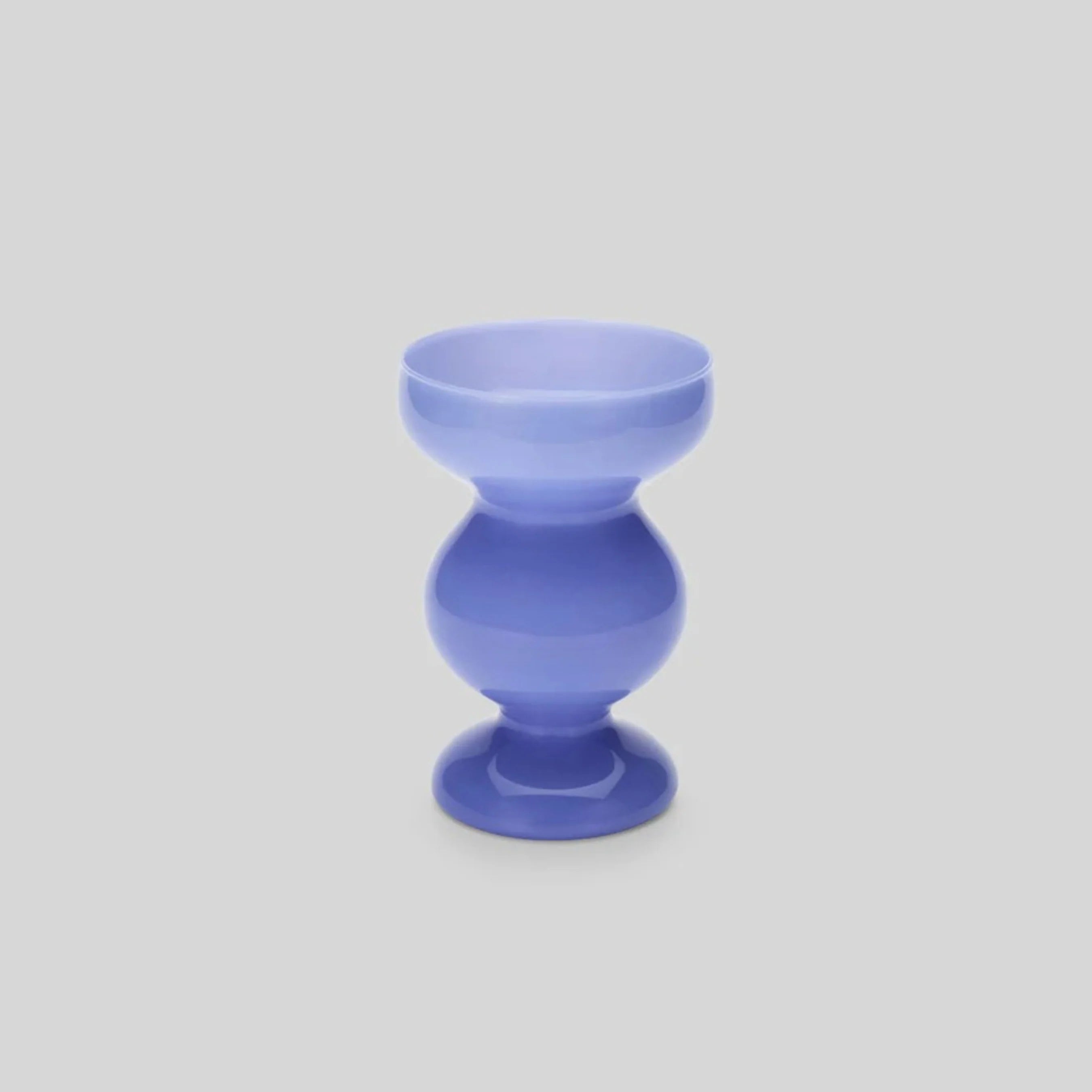 A pale blue glass curvy shaped vase