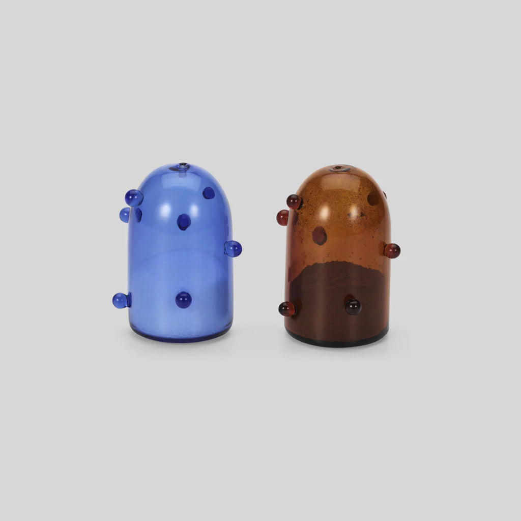 A clear blue and amber salt and pepper shaker set